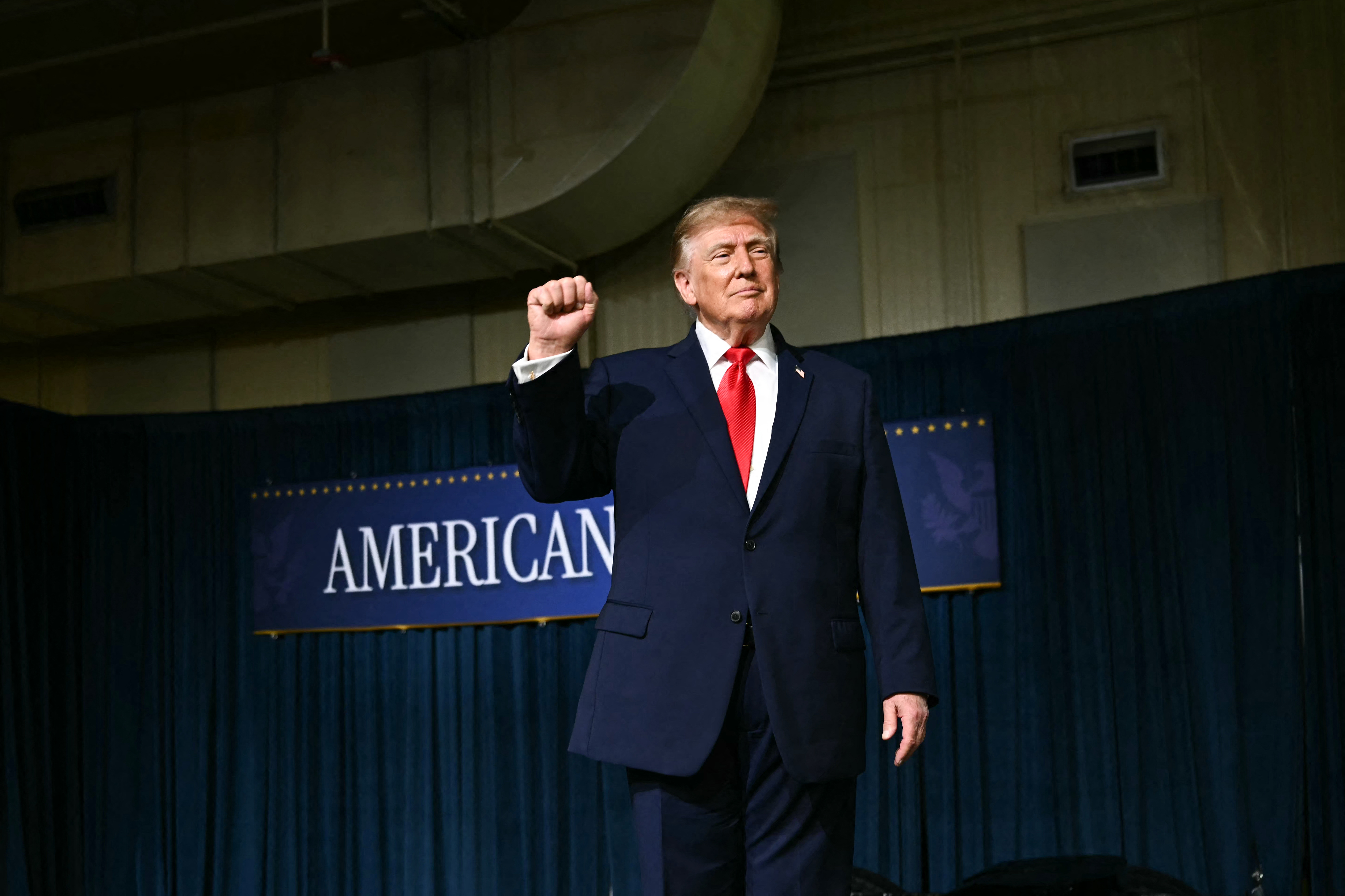 US President Donald Trump raises his fist after delivering remarks at the Peterbilt Motors facility in Denton, Texas, on October 1, 2026.