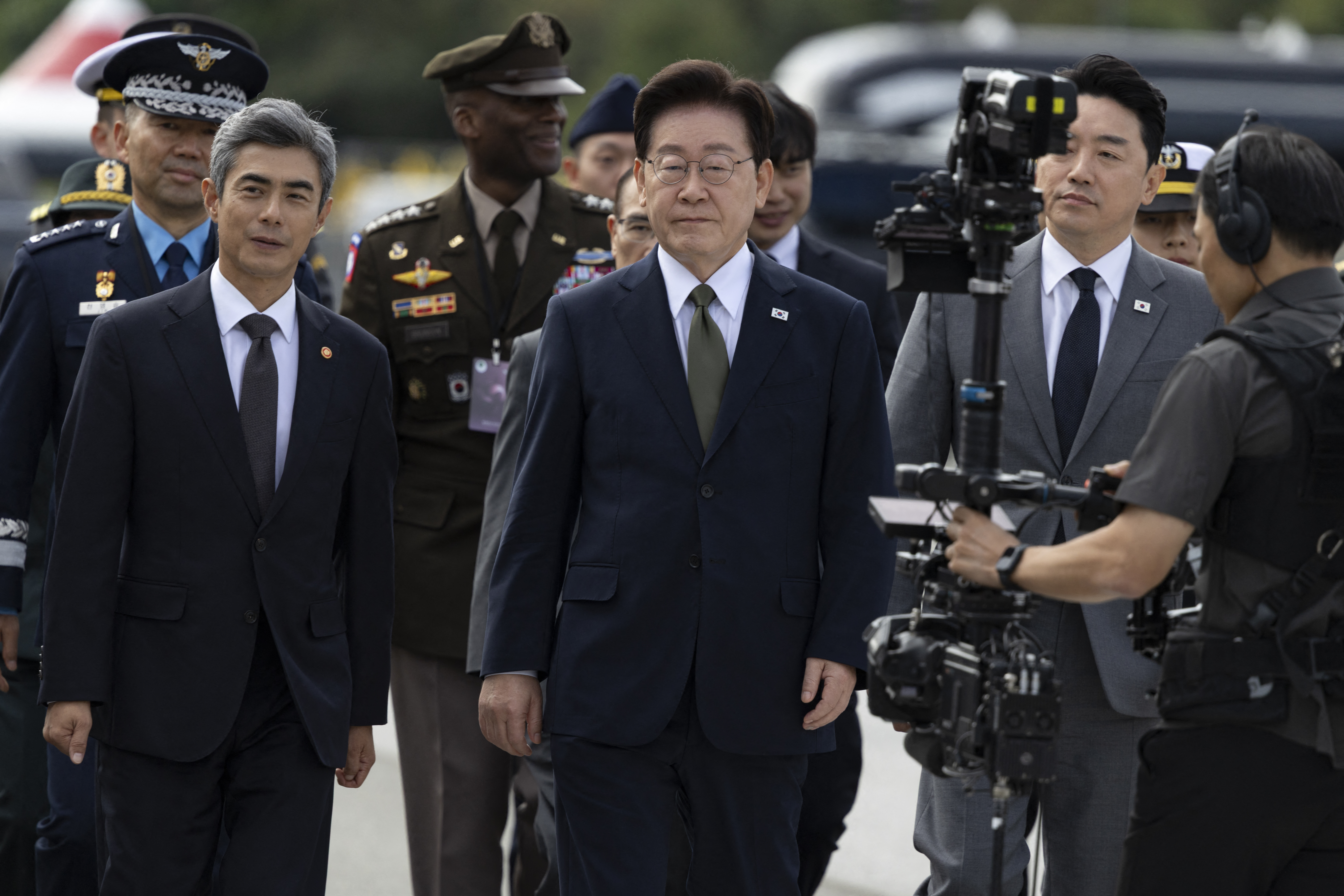 South Korean President Lee Jae Myung (C) arrives for the 78th Armed Forces Day at a military base in Gyeryong on October 1, 2026.