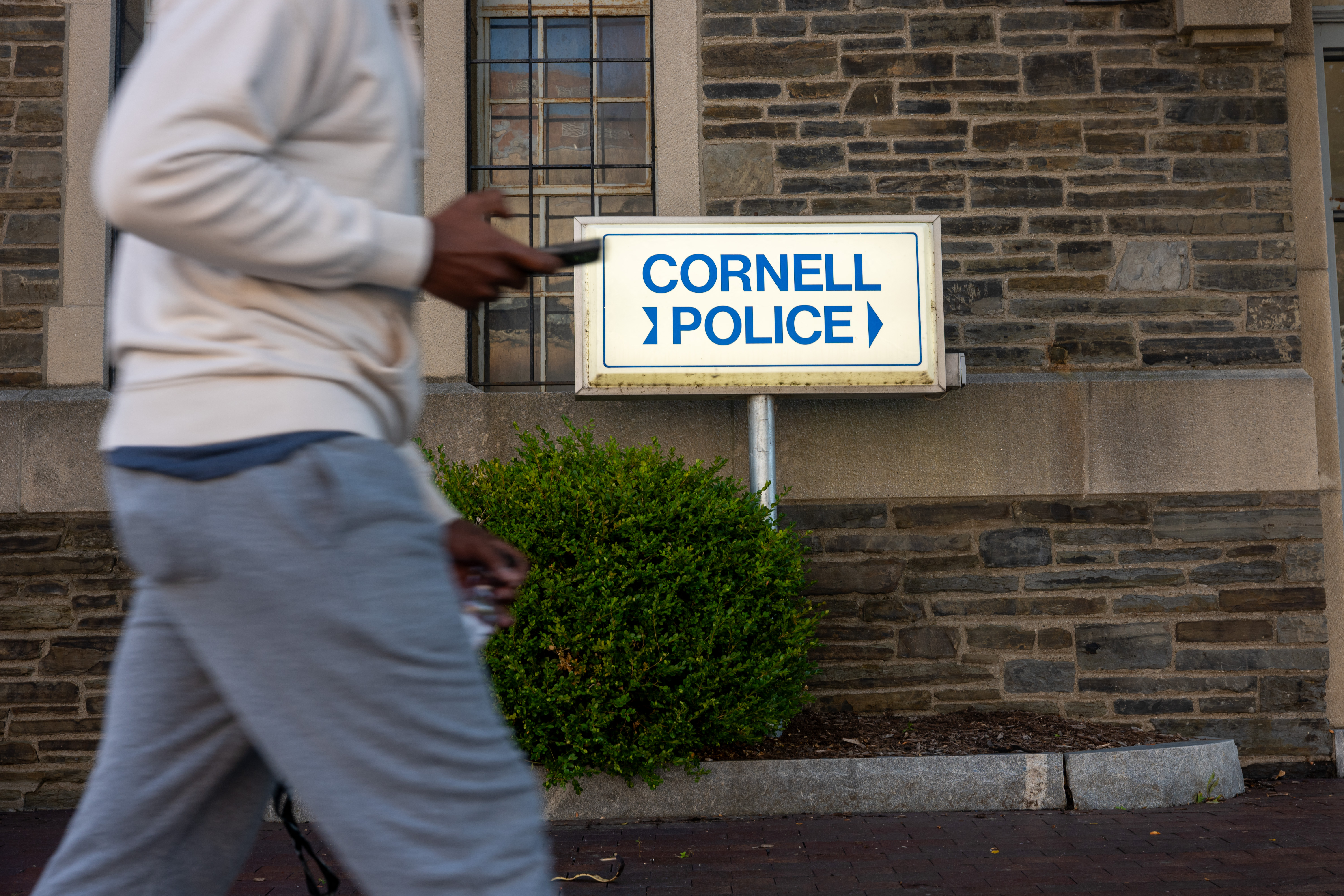 ITHACA, NEW YORK - SEPTEMBER 30: Students walk past Cornell Police headquarters on the Cornell University campus on September 30, 2026, in Ithaca, New York. The New York state attorney general has announced a review of the university’s initial response to allegations by a former Cornell student that she was raped at a campus fraternity in 2024. The student, who is being identified only as Jane Doe, has alleged she was drugged and gang-raped inside the Chi Phi fraternity house on October 19, 2024. Spencer Platt/Getty Images/AFP (Photo by SPENCER PLATT / GETTY IMAGES NORTH AMERICA / Getty Images via AFP)