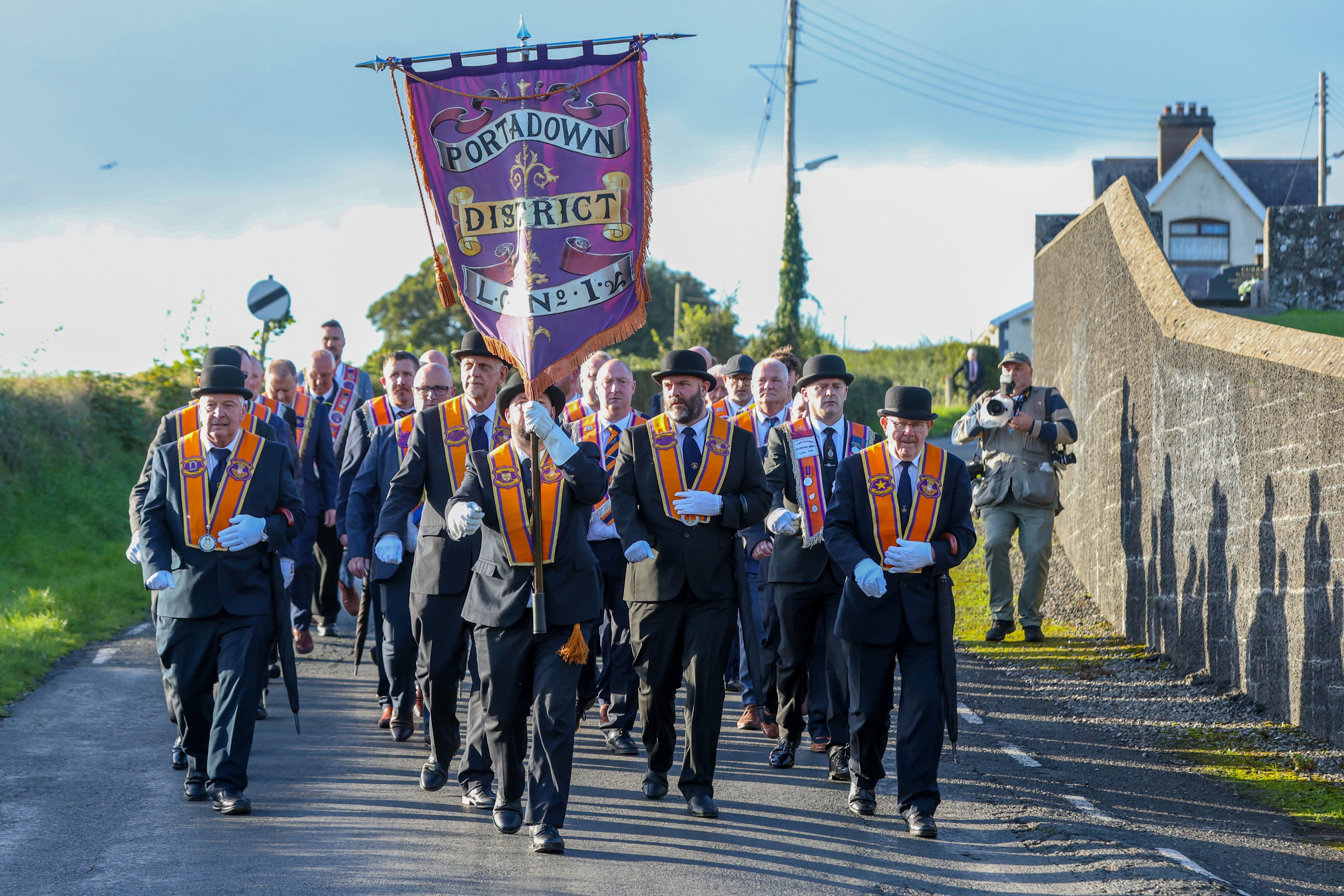 Portadown Orangemen march from Drumcree Church to start their march towards Garvaghy Road, which was stopped a short distance later by police, in Portadown, Northern Ireland on September 27, 2026 [AFP]