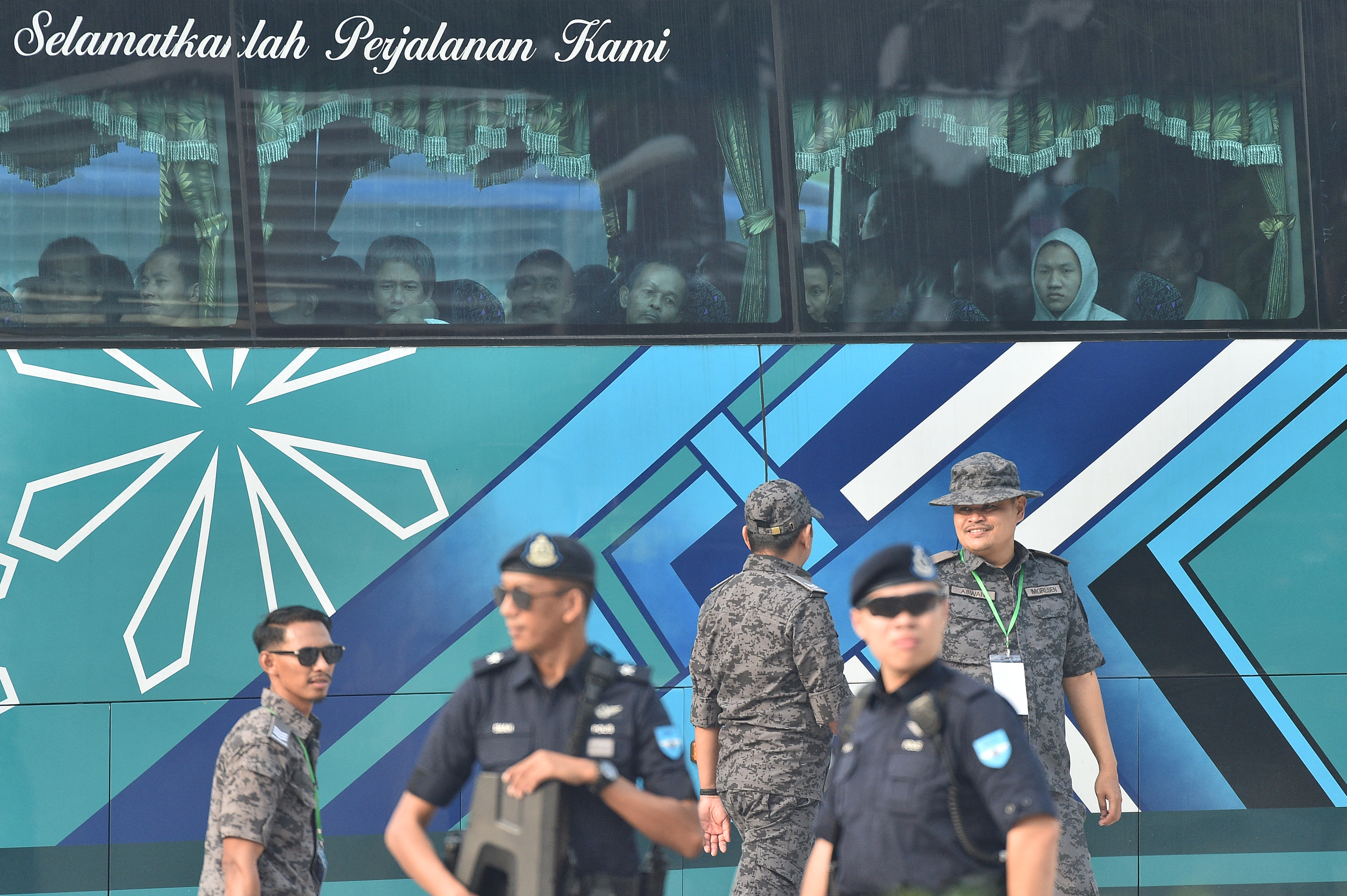 A bus carrying Myanmar nationals being repatriated from Malaysia to their homeland, is seen heading toward to navel base in Lumut, on the outskirts of Kuala Lumpur on September 29, 2026.