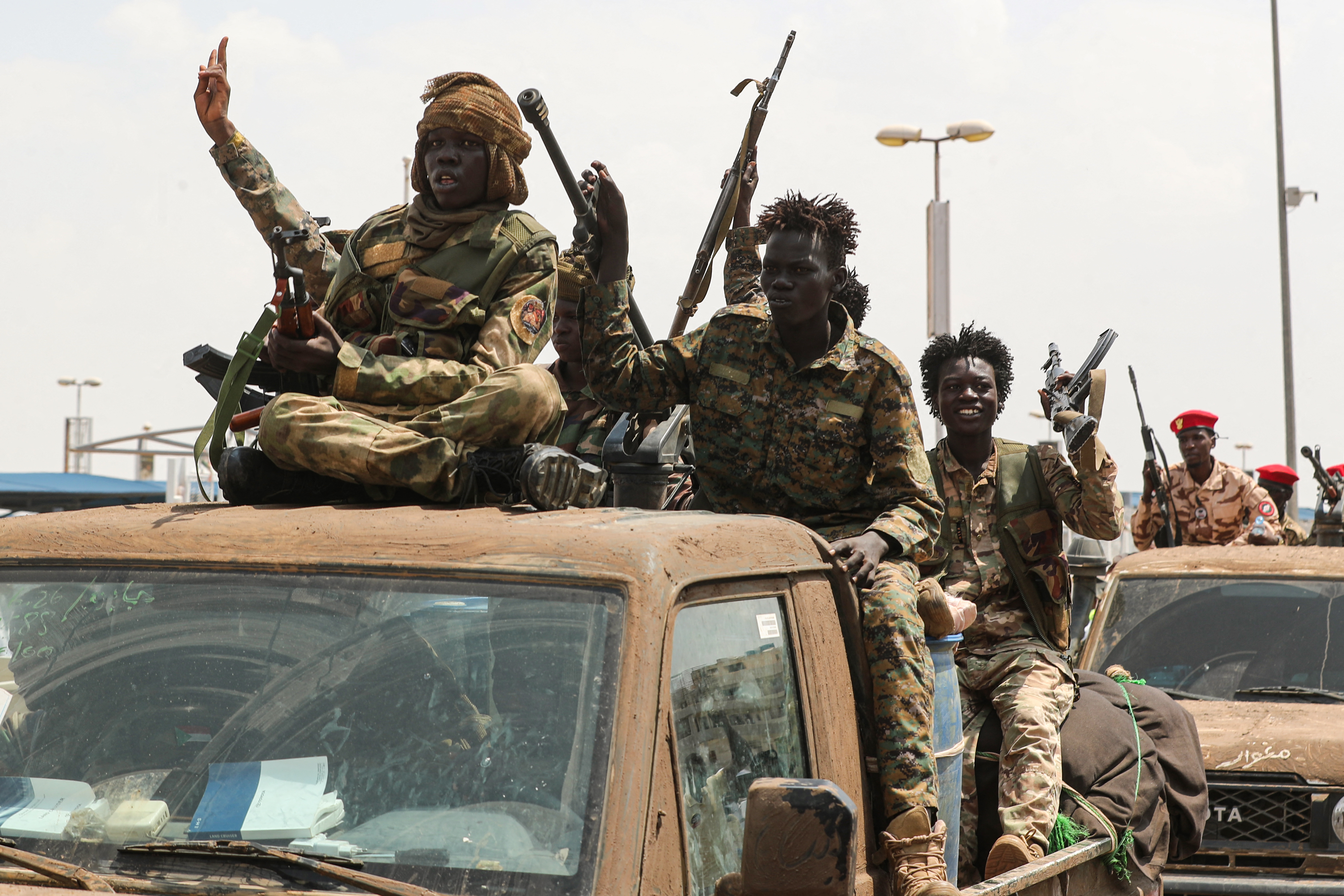 TOPSHOT - Soldiers are seen at Khartoum International Airport in Khartoum on October 3, 2026, during a reception for Darfur Regional Governor and leader of the Sudan Liberation Movement (SLM), Minni Arko Minnawi (not pictured), after he took part in the 81st United Nations General Assembly.