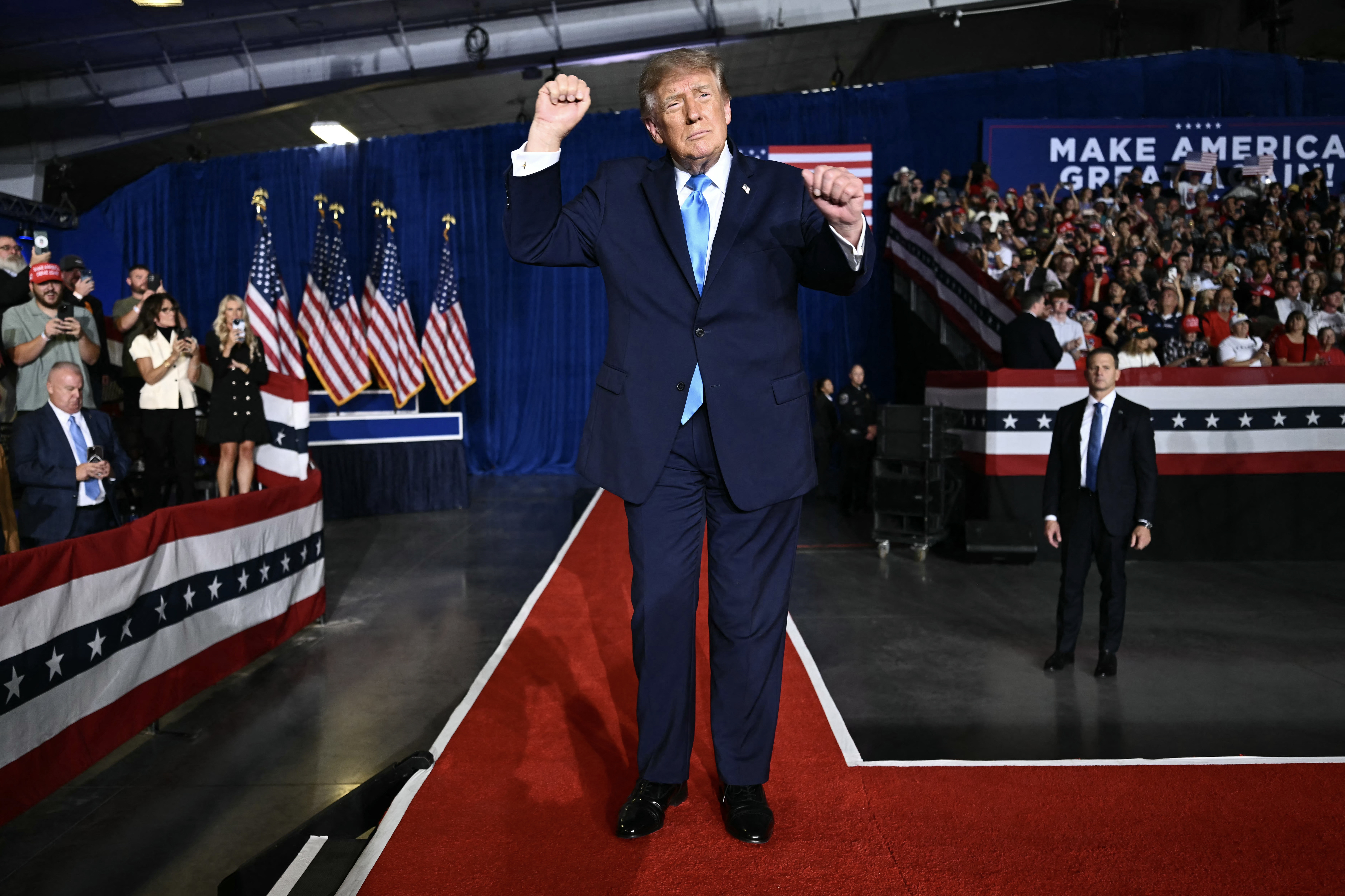 US President Donald Trump dances after speaking during a campaign rally at Pinnacle Bank Expo Center in Grand Island, Nebraska, on October 5, 2026. (Photo by Kent NISHIMURA / AFP)
