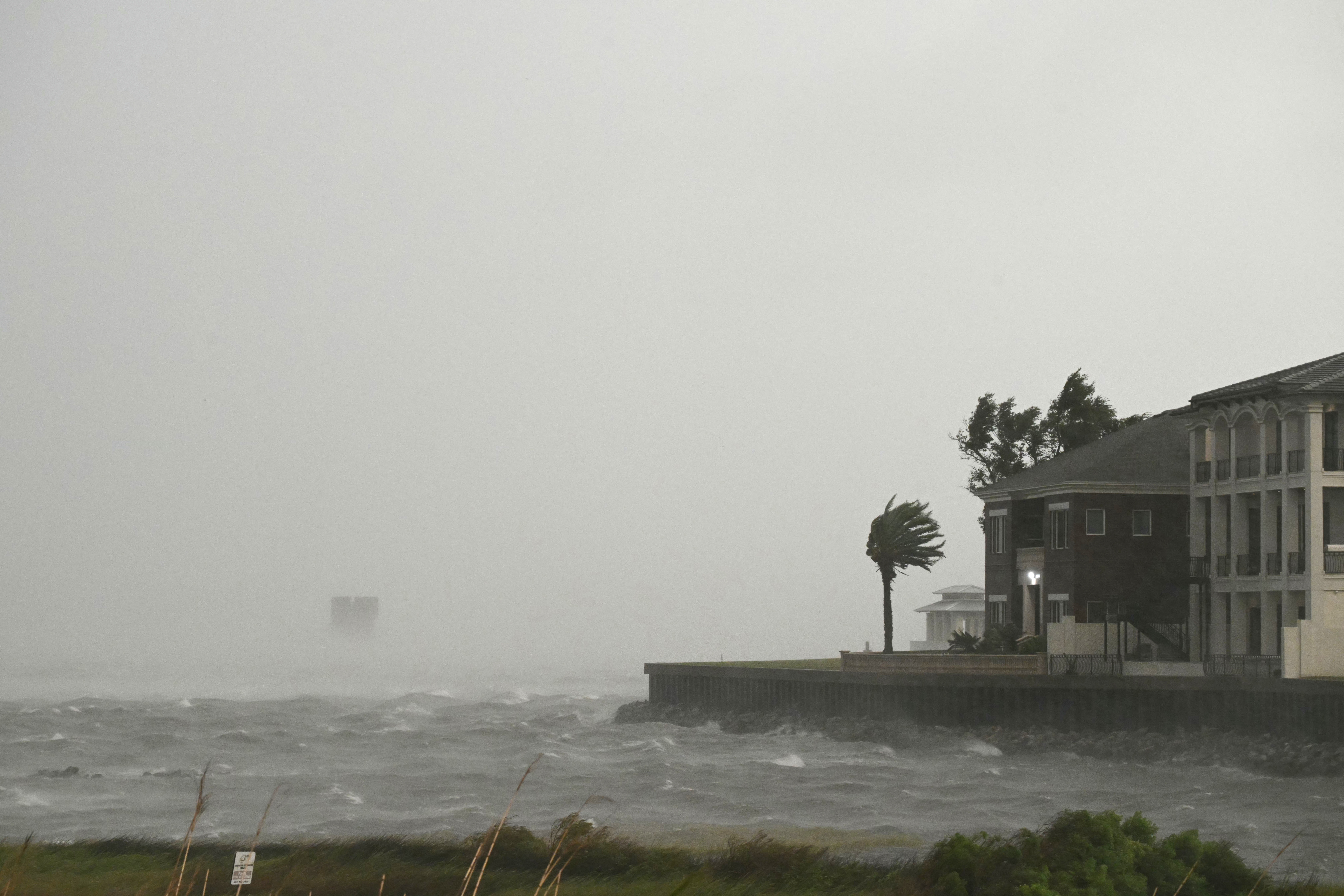 A house is battered by the strong winds and storm surge of Hurricane Isaias in Pensacola, Florida, on October 9, 2026.
