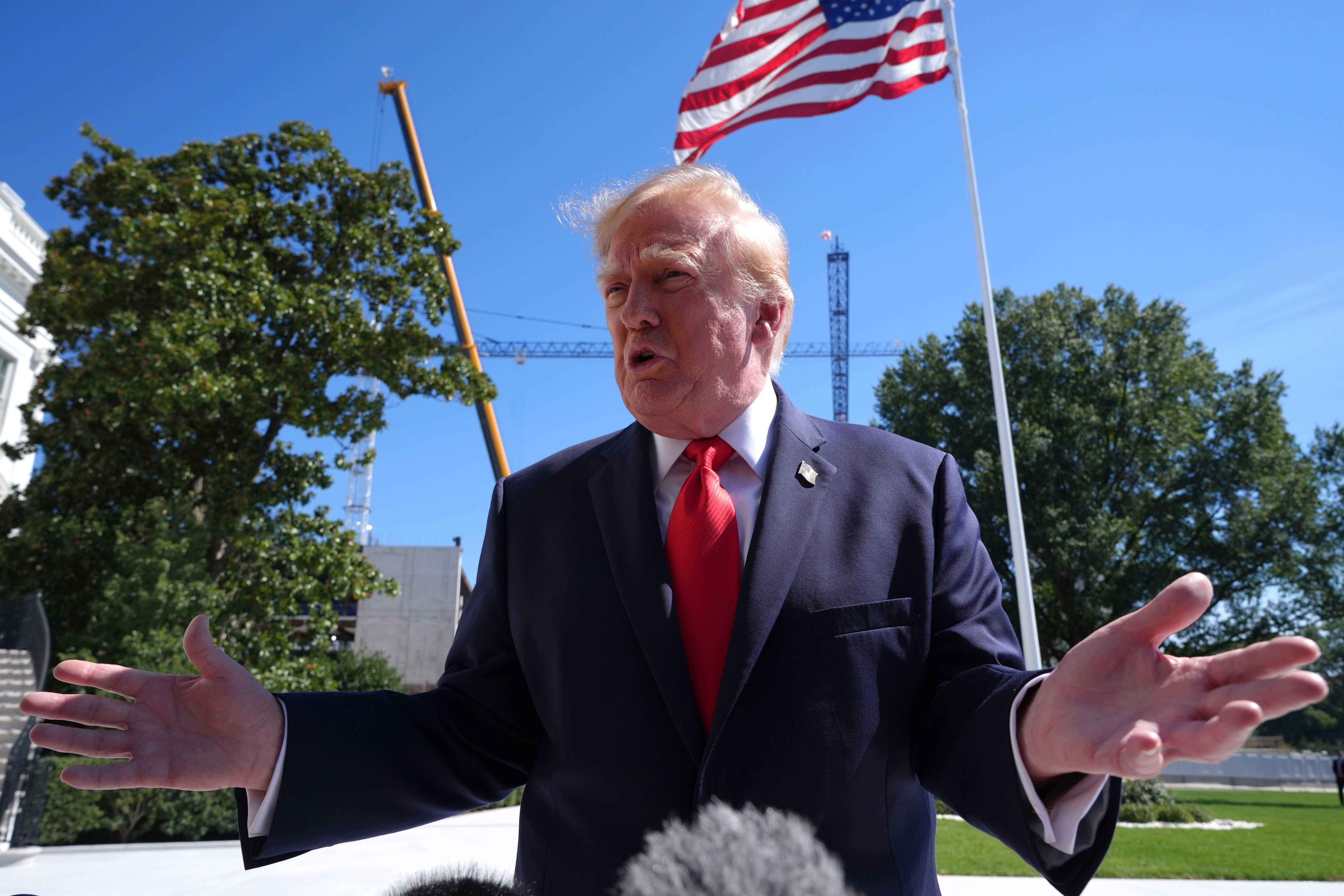 President Donald Trump speaks with reporters before boarding Marine One on the South Lawn of the White House, Thursday Oct. 1, 2026, in Washington. (AP Photo/Jacquelyn Martin)