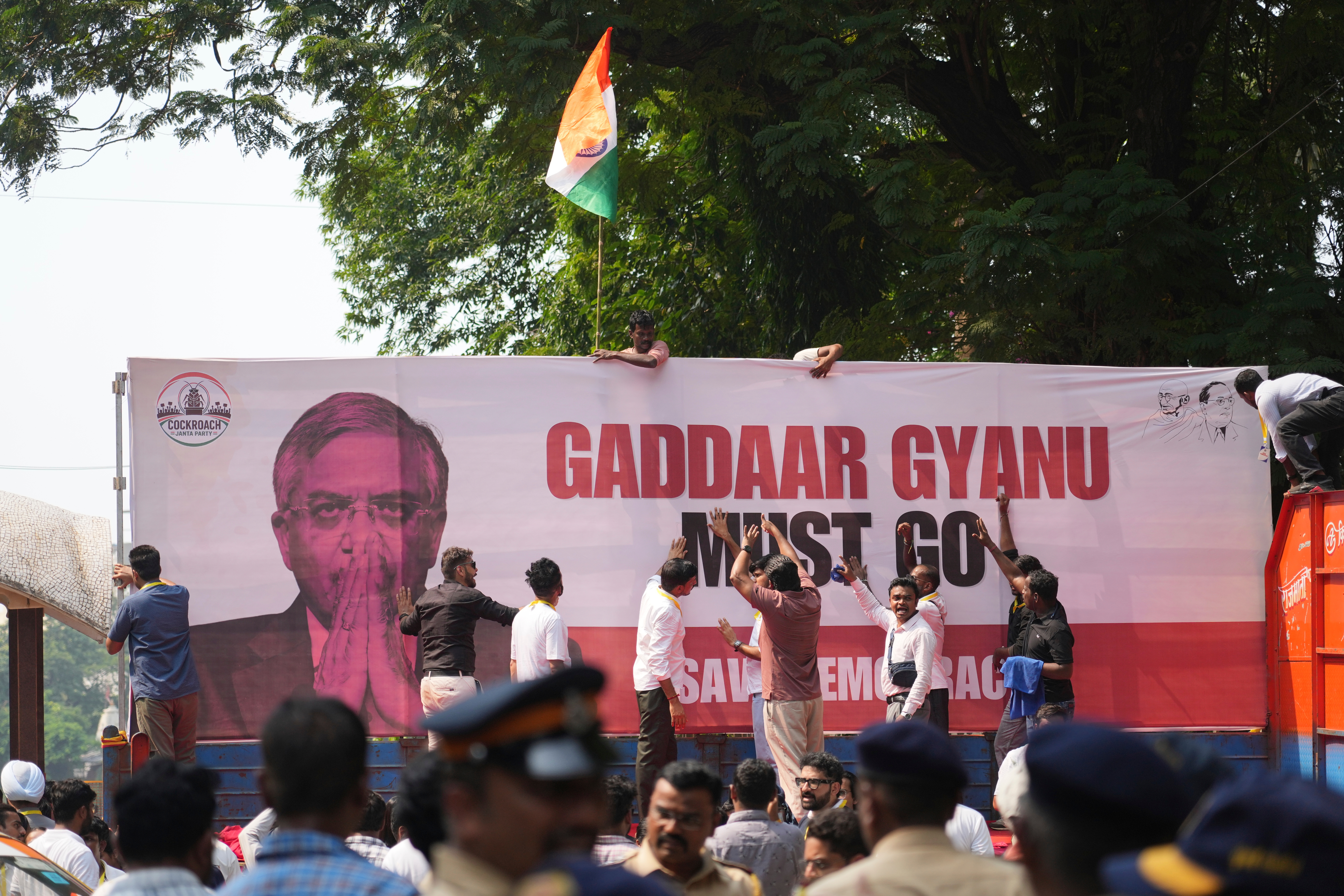 Supporters of the Cockroach Janta Party shout slogans during a protest against Chief Election Commissioner Gyanesh Kumar and call for the suspension of the Special Intensive Revision (SIR) of electoral rolls in Mumbai, India, Friday, Oct. 2, 2026. (AP Photo/Rafiq Maqbool)