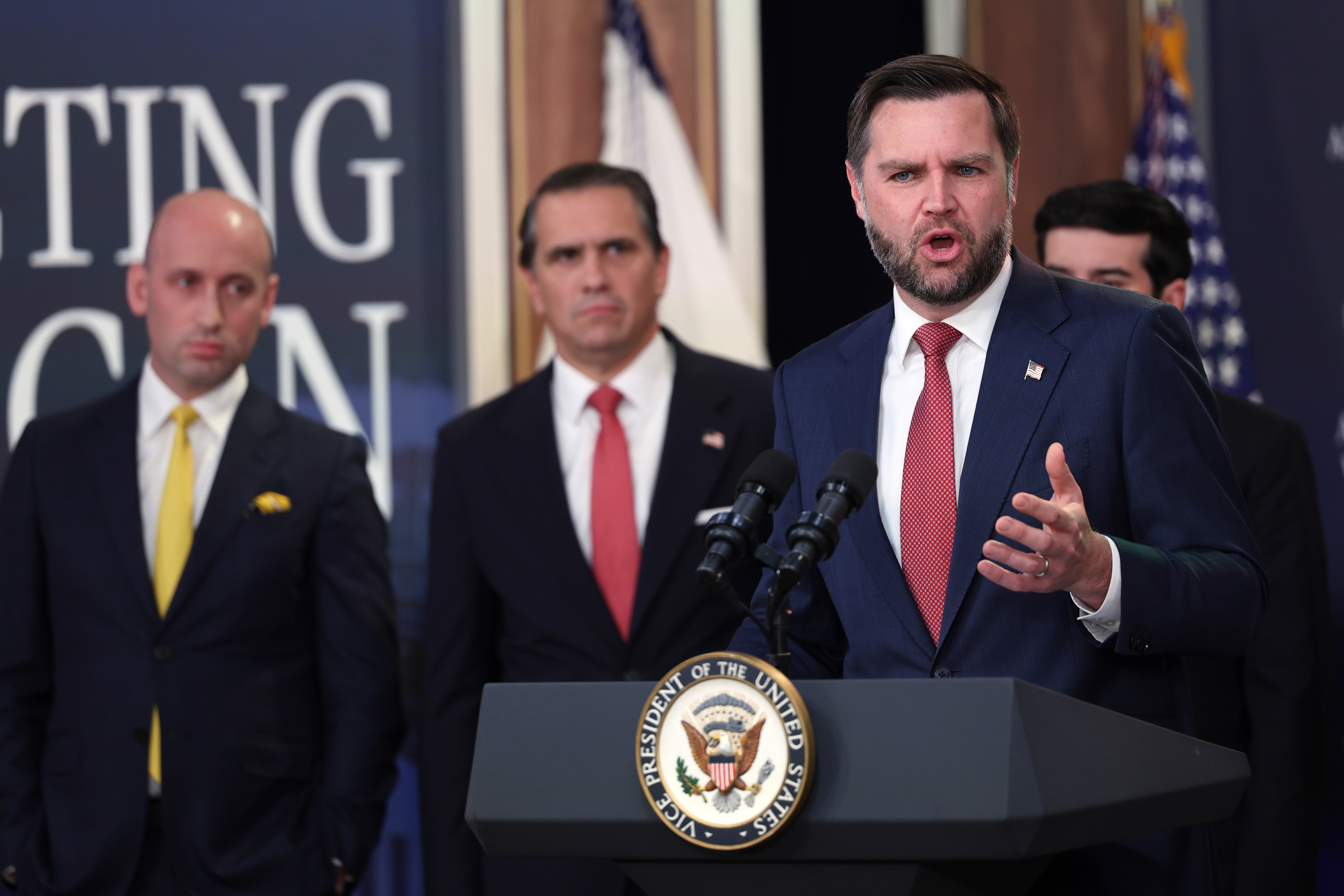 Vice President JD Vance speaks as Stephen Miller, White House deputy chief of staff, from left, and Attorney General Todd Blanche listen during a news conference on the Fraud Task Force inside the Eisenhower Executive Office Building on the White House campus, Thursday, Oct. 8, 2026, in Washington. (AP Photo/Tom Brenner)