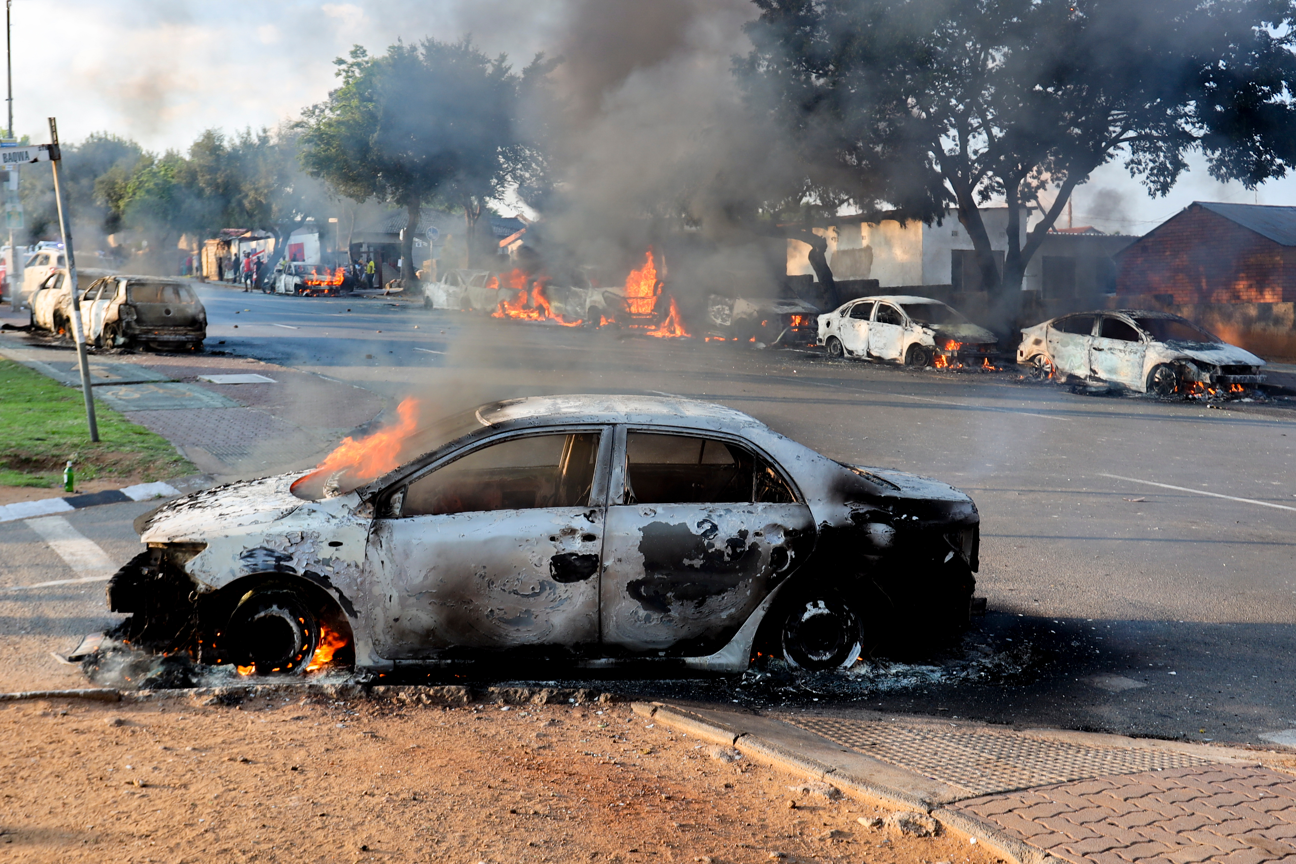 A car burns after it was set alight during protests related to immigration issues in Soweto, Johannesburg, Thursday, Oct. 8, 2026. (AP Photo)