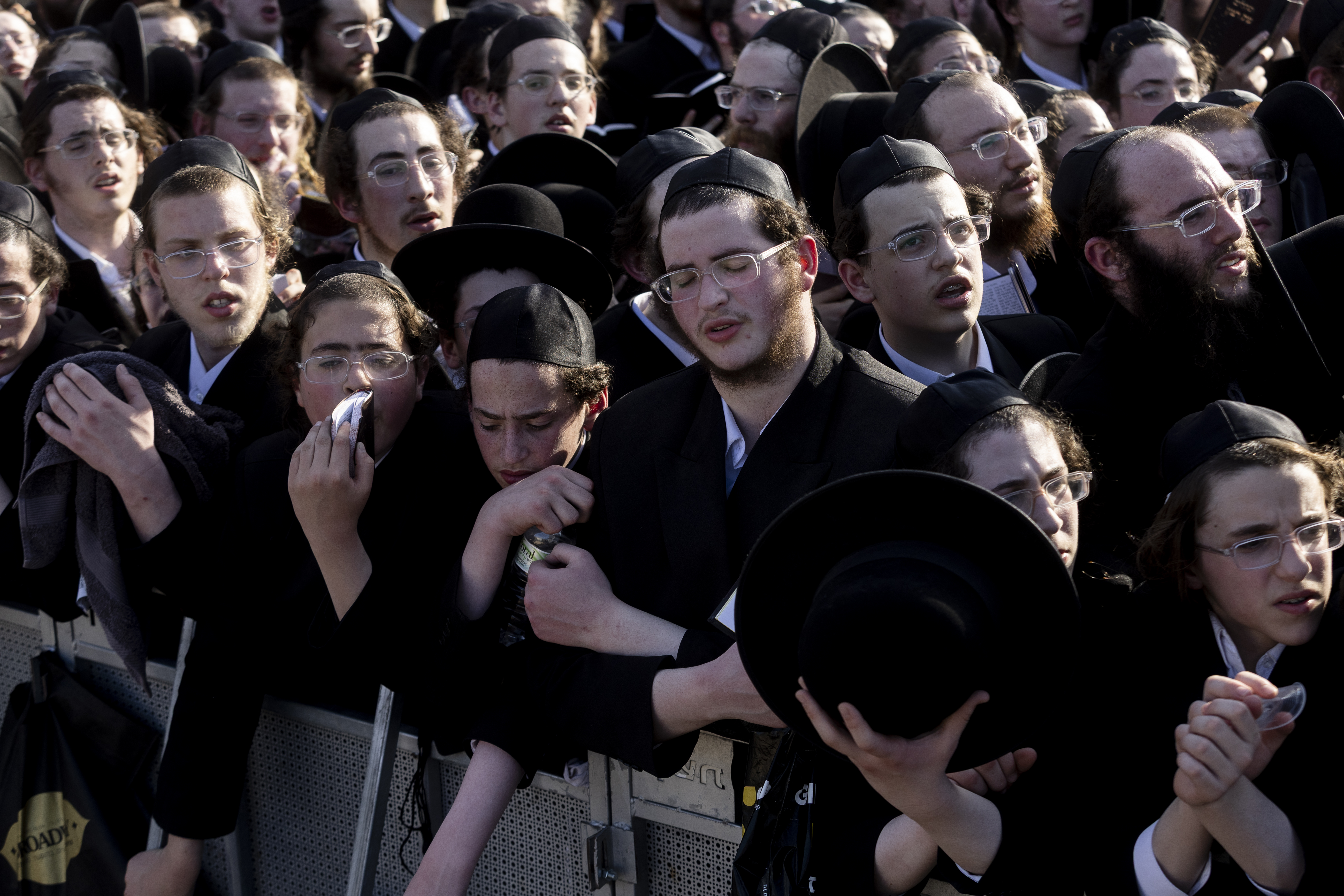 KFAR YONA, ISRAEL - JUNE 17: Men pray during demonstration by Ultra-Orthodox Jews against Israel's military draft on June 17, 2026 outside the Beit Lid military base in Kfar Yona, Israel. The conscription of young ultra-Orthodox men into the military, from which they were long exempt before the exemption was ended during the country's war with Hamas, continues to roil Israeli politics. (Photo by Amir Levy/Getty Images)