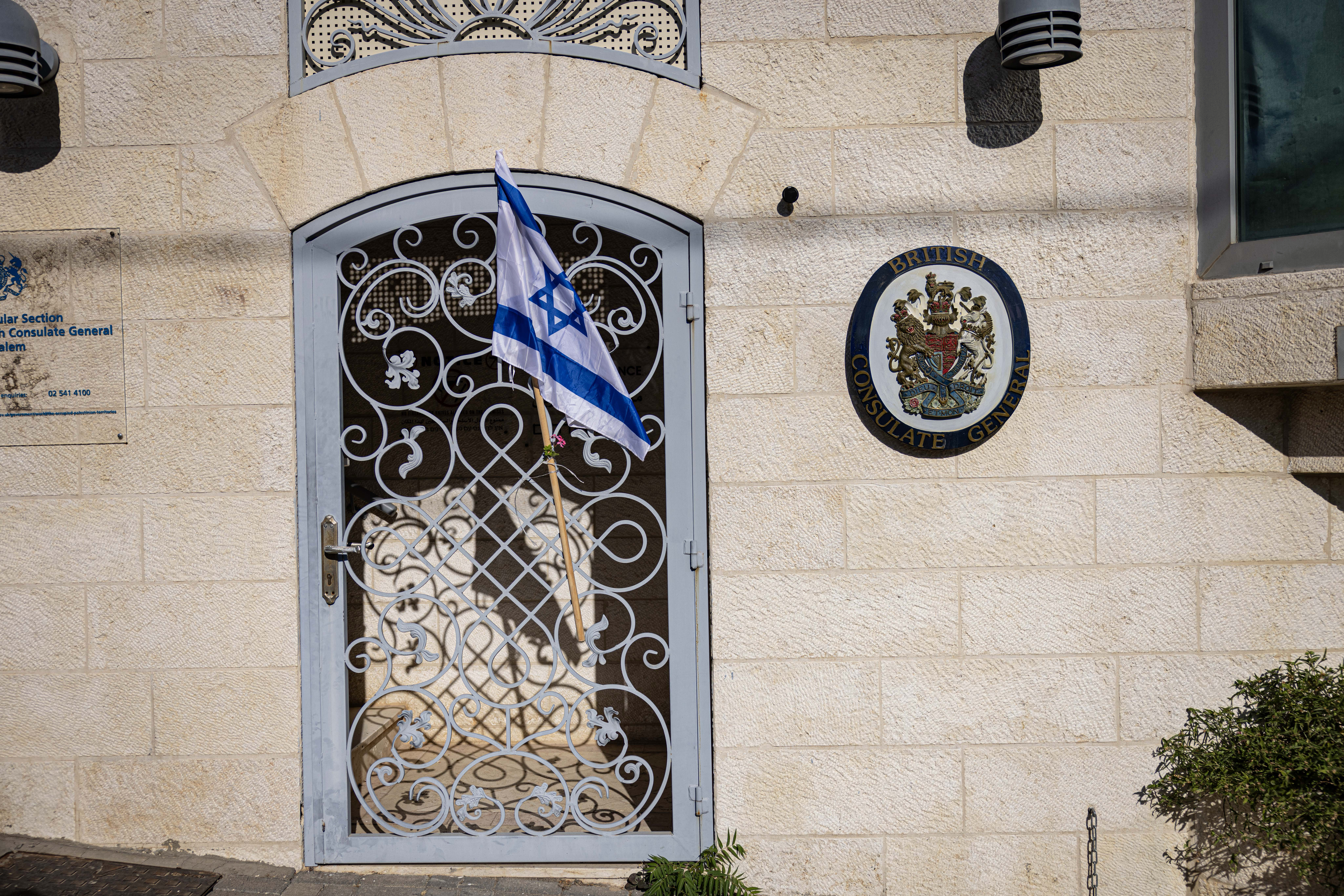JERUSALEM - SEPTEMBER 14: Israeli right-wing activists place an Israeli flag outside the residence of the British Consulate in Jerusalem during a protest against the recently announced British sanctions, aimed at economic activity in Israeli settlements in the West Bank, on September 14, 2026 in Jerusalem. The expansion of Israeli settlements in the West Bank, considered illegal under international law, has prompted the British government to impose a ban on goods imported from the occupied West Bank. Israeli officials responded furiously, ordering the closure of the British consulate in Jerusalem, Britain's diplomatic mission to occupied Palestine. In a speech to the UK House of Commons last week, the British foreign secretary described Jewish settler activity in the occupied West Bank as "ethnic cleansing." (Photo by Faiz Abu Rmeleh/Getty Images)