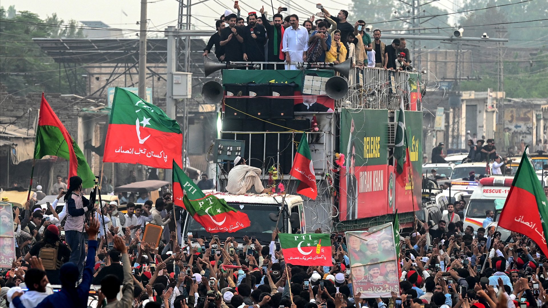 Supporters of the Pakistan Tehreek-e-Insaf (PTI) party take part in a protest march demanding the release of jailed former prime minister Imran Khan in Peshawar on October 9, 2026. [Photo by Abdul MAJEED / AFP]