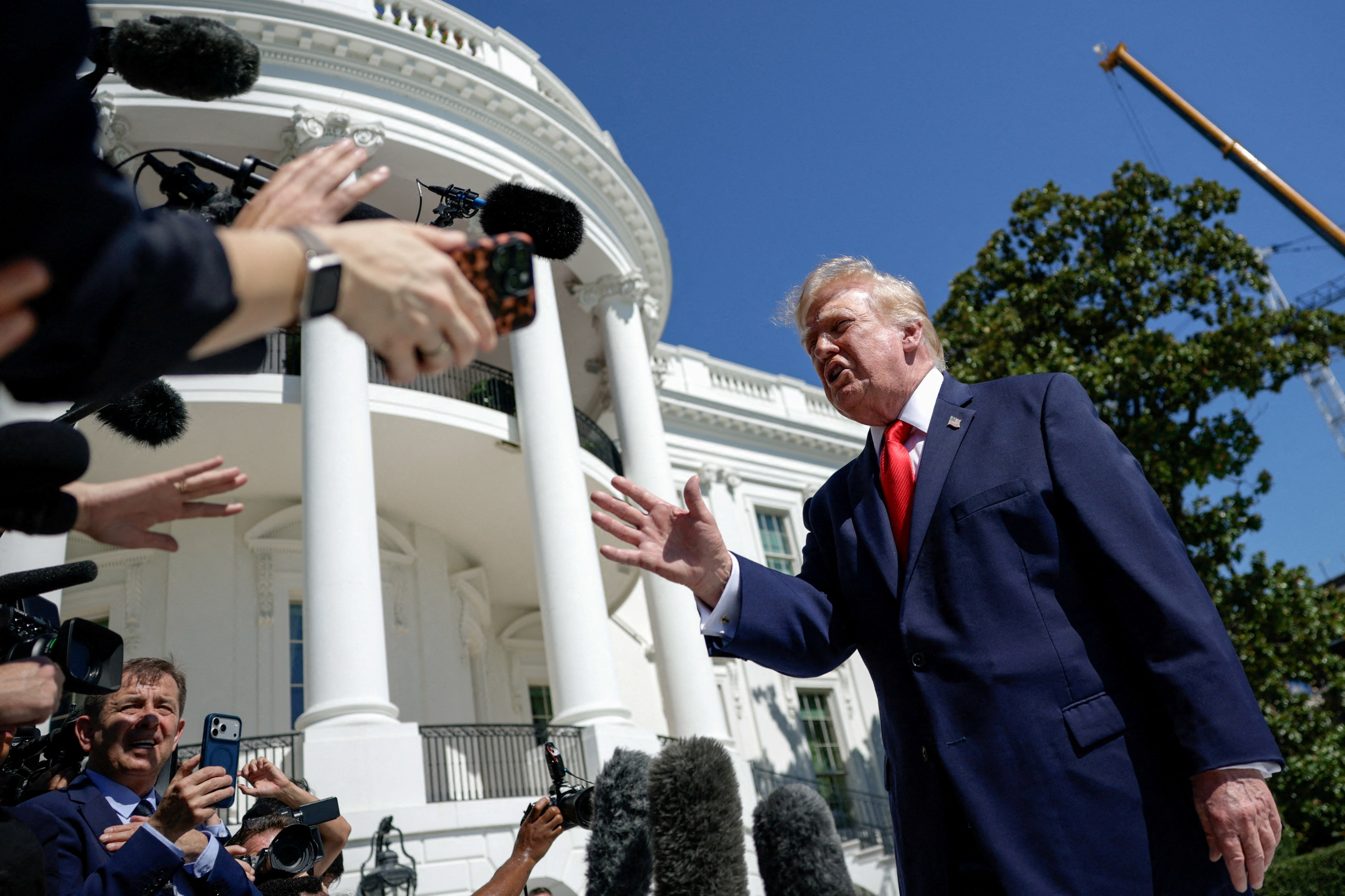 FILE PHOTO: US President Donald Trump speaks to reporters before boarding Marine One as he departs for Denton, Texas, on the South Lawn of the White House in Washington, D.C., US, October 1, 2026. REUTERS/Evan Vucci/File Photo