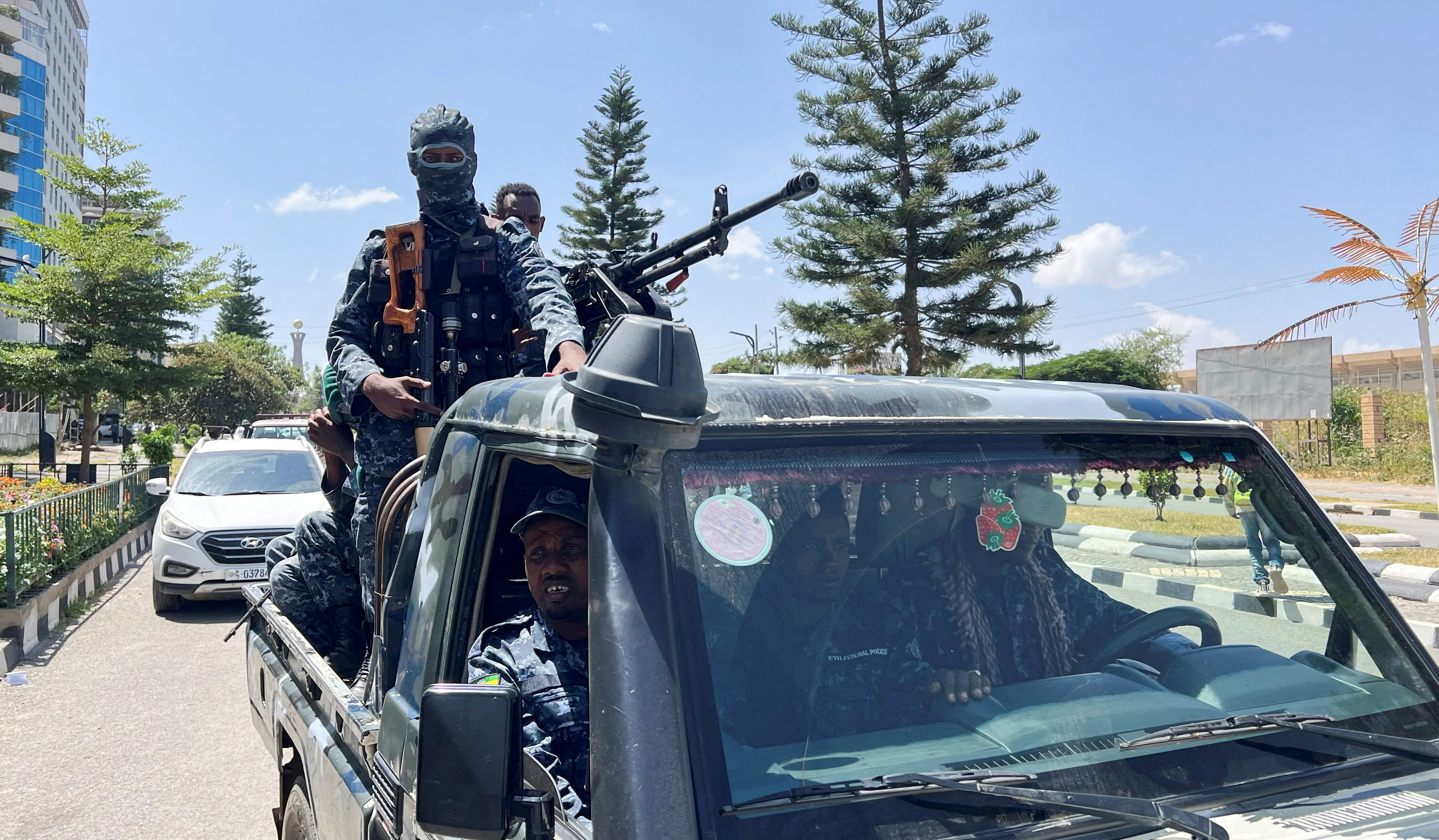 Members of the Ethiopian Federal Police (EFP) patrol after Tigray People’s Liberation Front (TPLF) army retreated from the regional capital near the Tigray Martyrs monument in Mekelle, Tigray Region, Ethiopia, October 8, 2026. Picture taken with a mobile phone. Obtained by REUTERS TPX IMAGES OF THE DAY