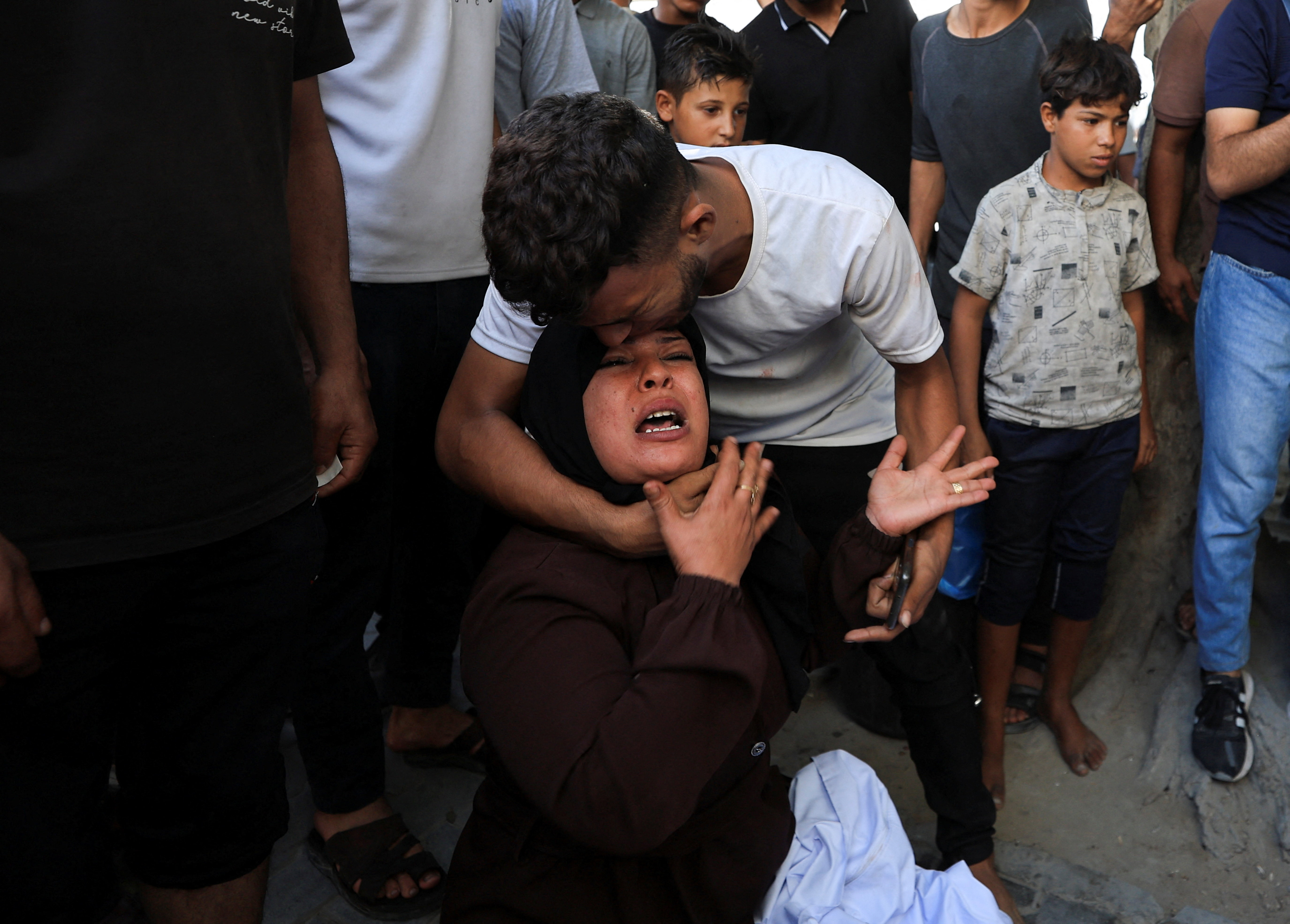 People mourn Palestinians who were killed in an Israeli air strike, according to medics, in Gaza City, October 10, 2026. REUTERS/Dawoud Abu Alkas