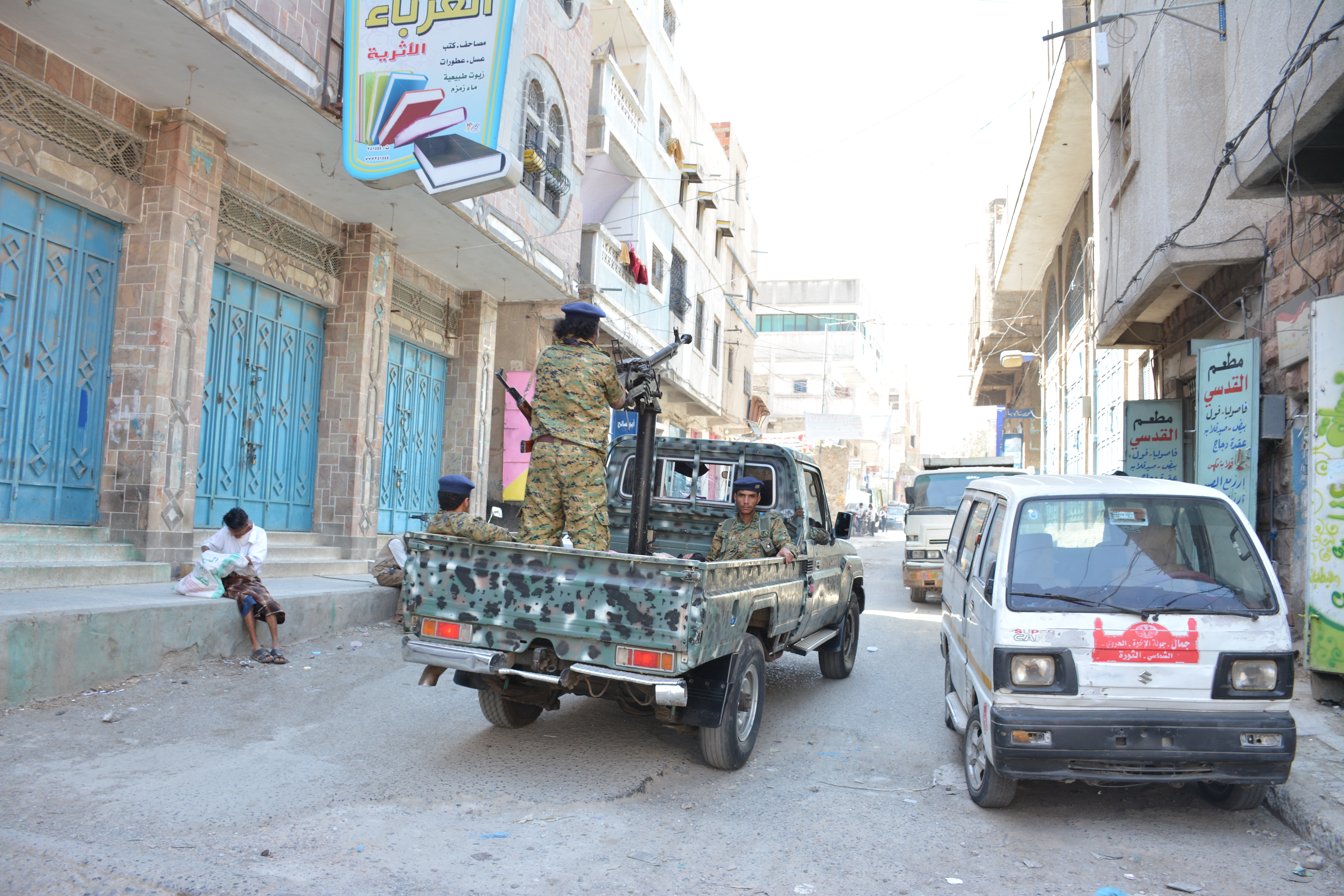 Soldiers on the back of a military pick up truck